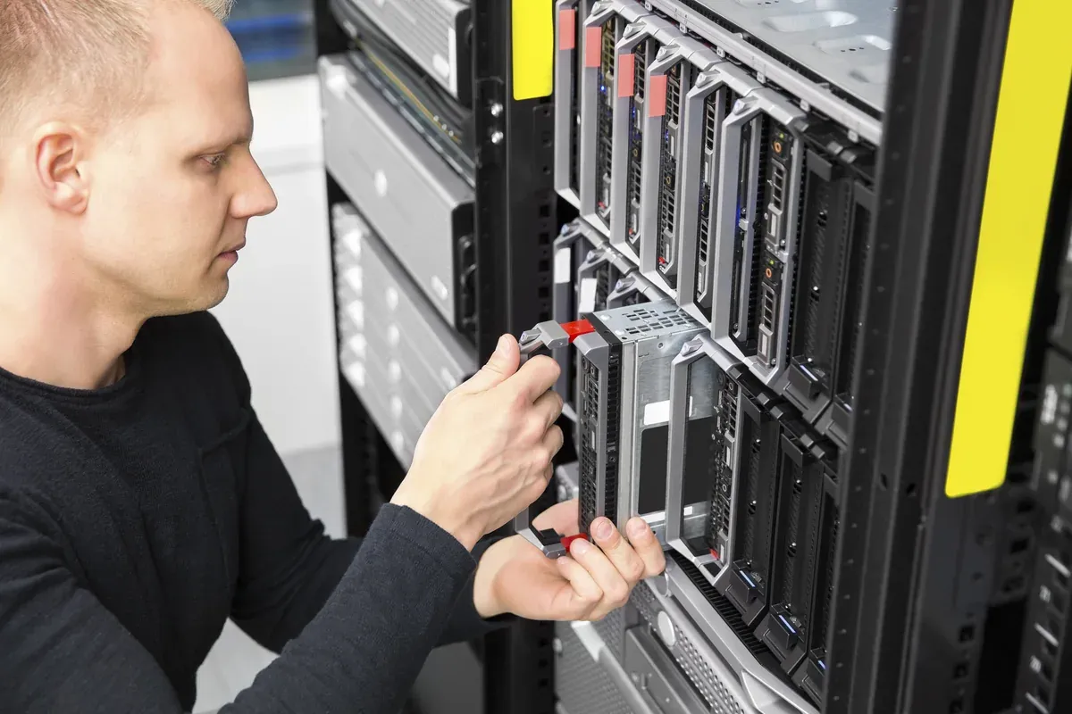 Sheernox IT consultant installing blade server hardware in enterprise rack